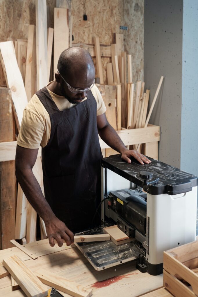 Male Carpenter Cutting Wood